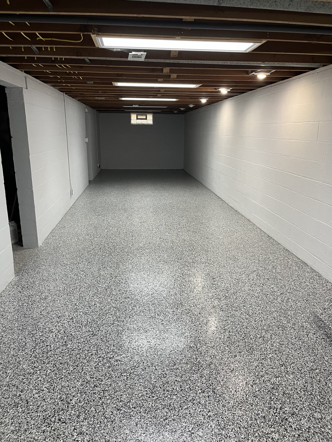 Finished basement with flake flooring