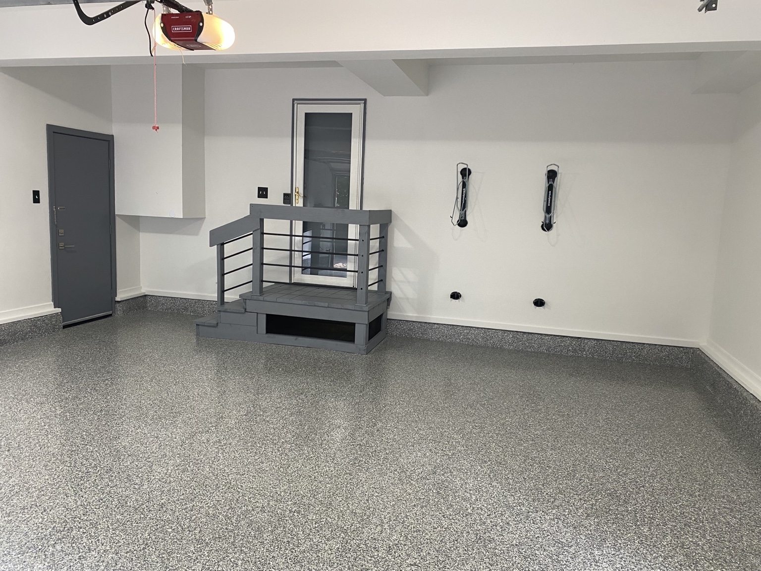 Finished garage with gray flake floor and painted walls