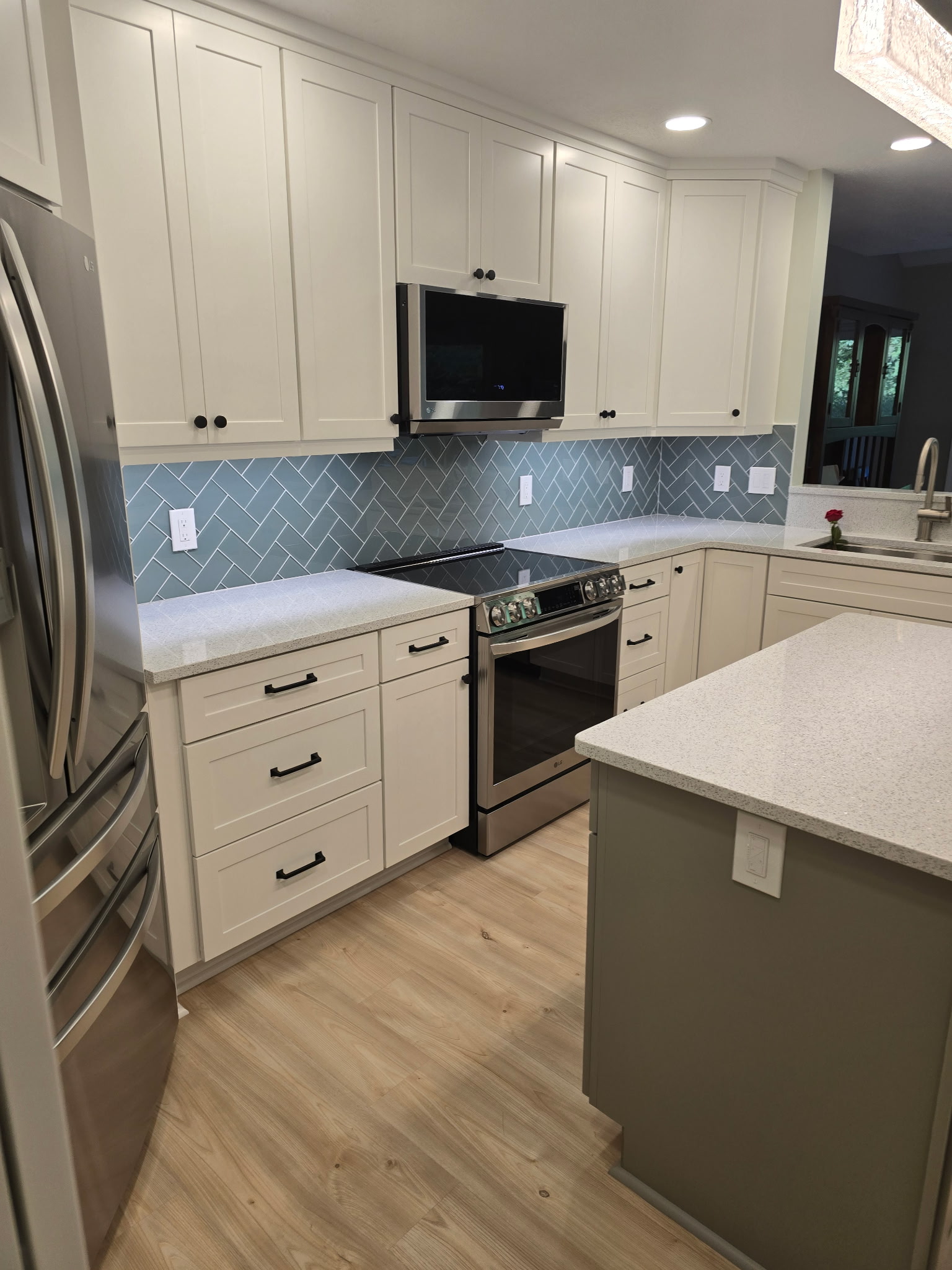 Kitchen with herringbone tile backsplash